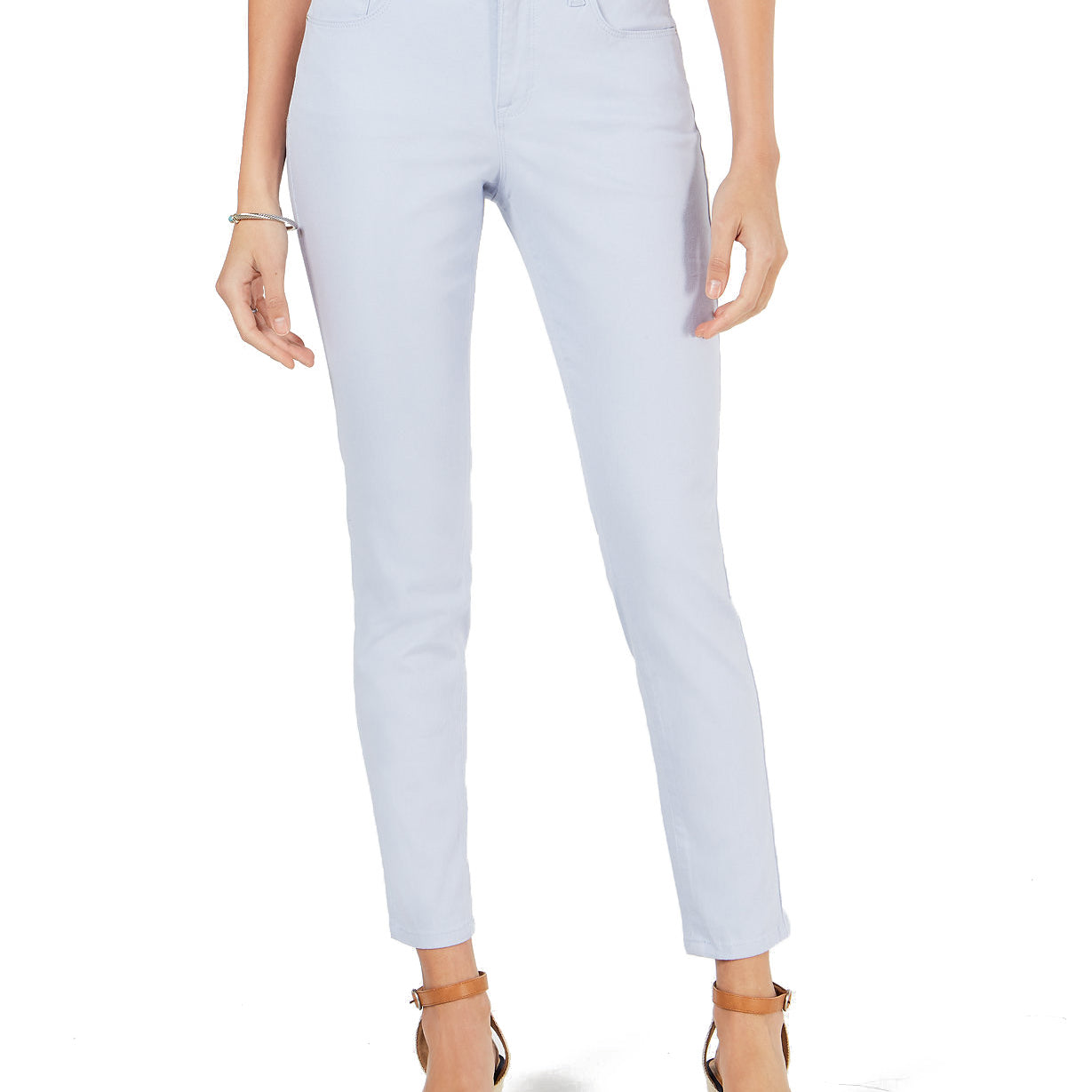 Light blue jeans worn by a person on a white background