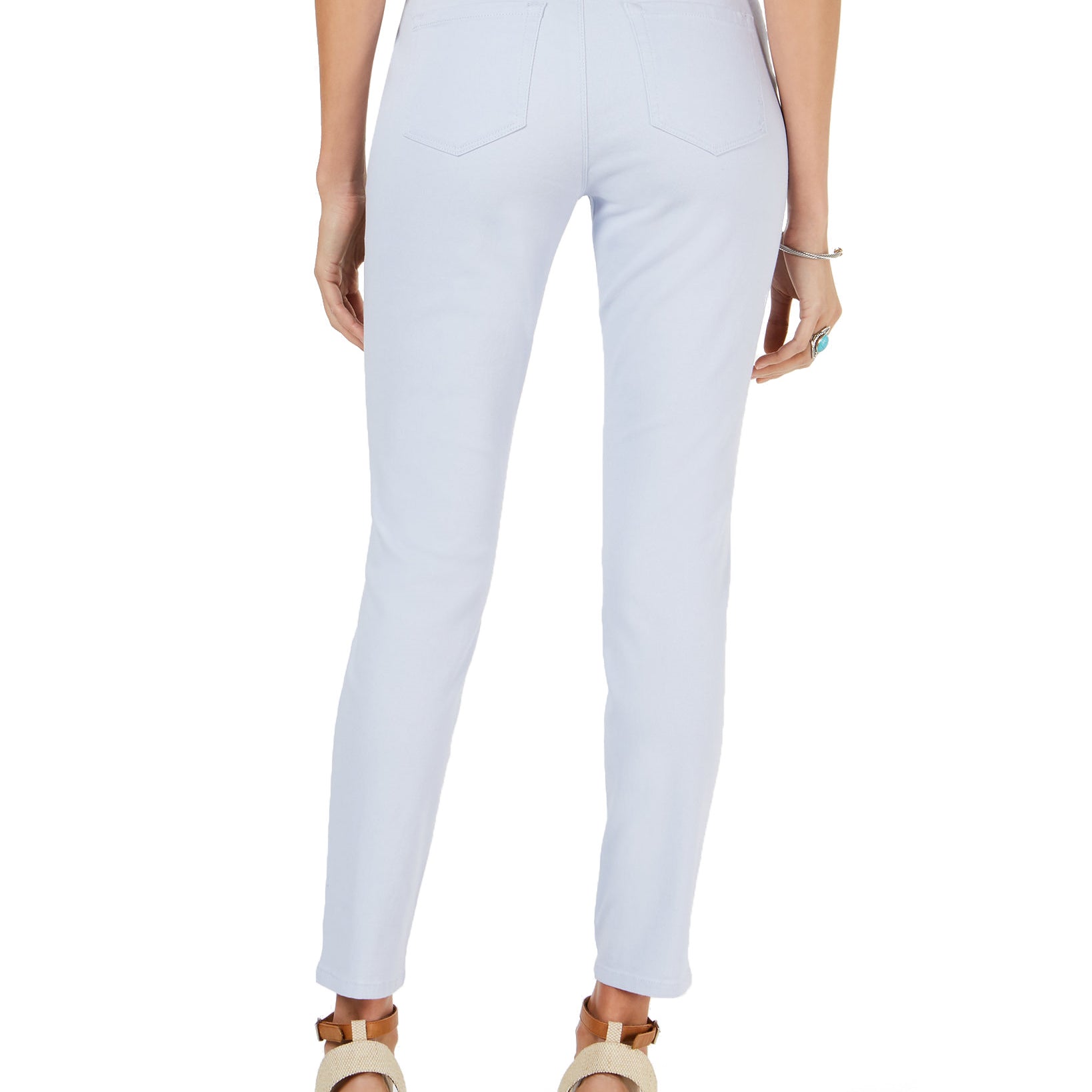 Light blue jeans worn by a person on a white background