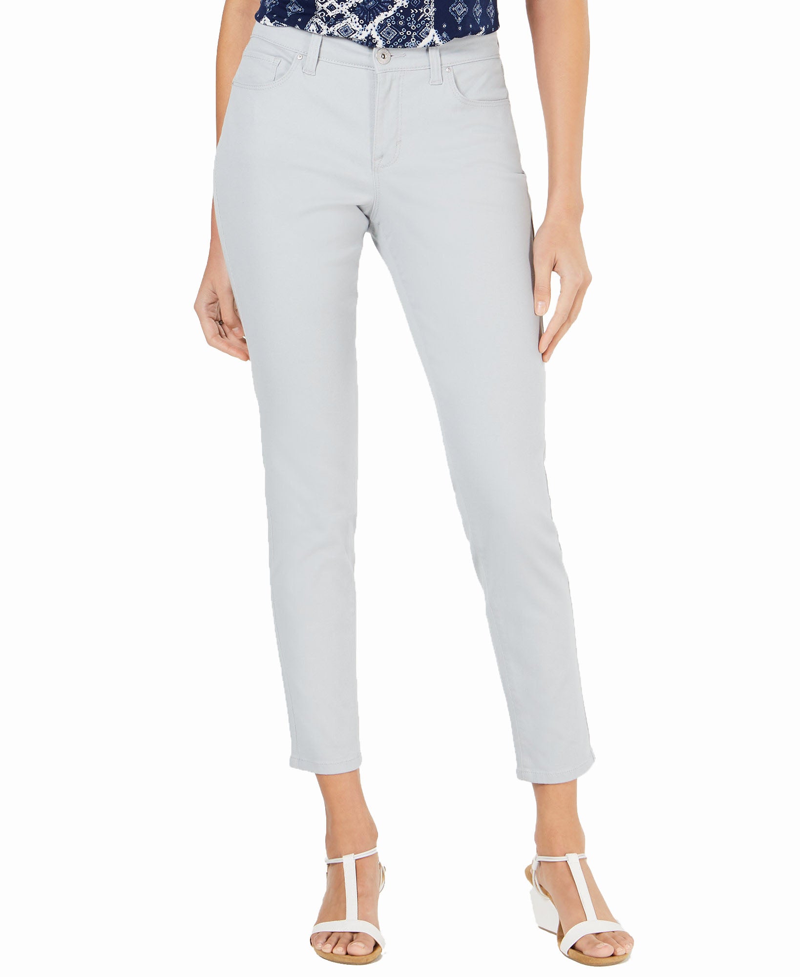 Light gray jeans worn by a person on a white background