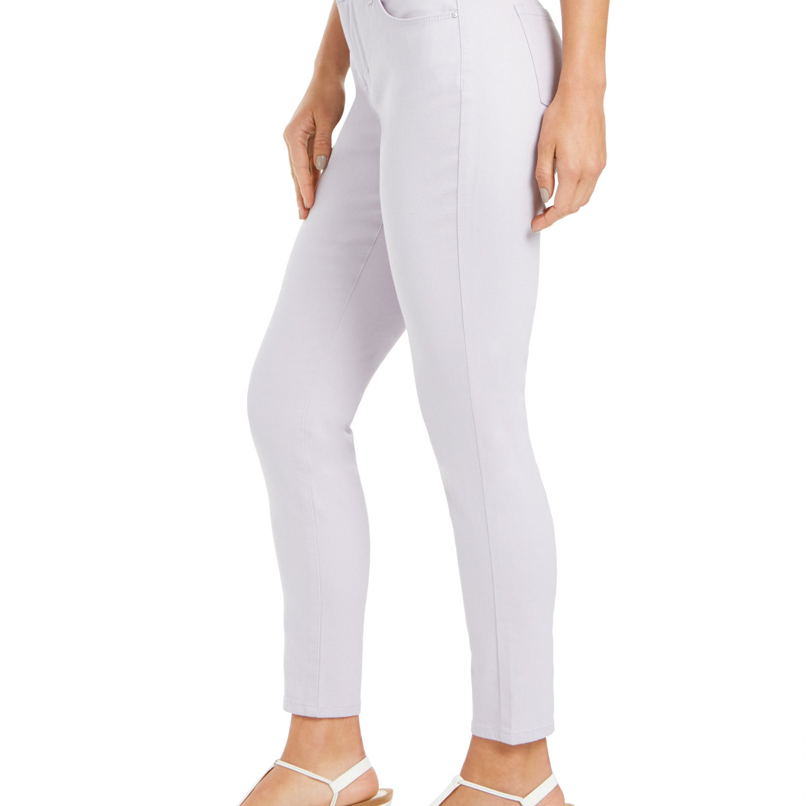 Light purple jeans worn by a person on a white background