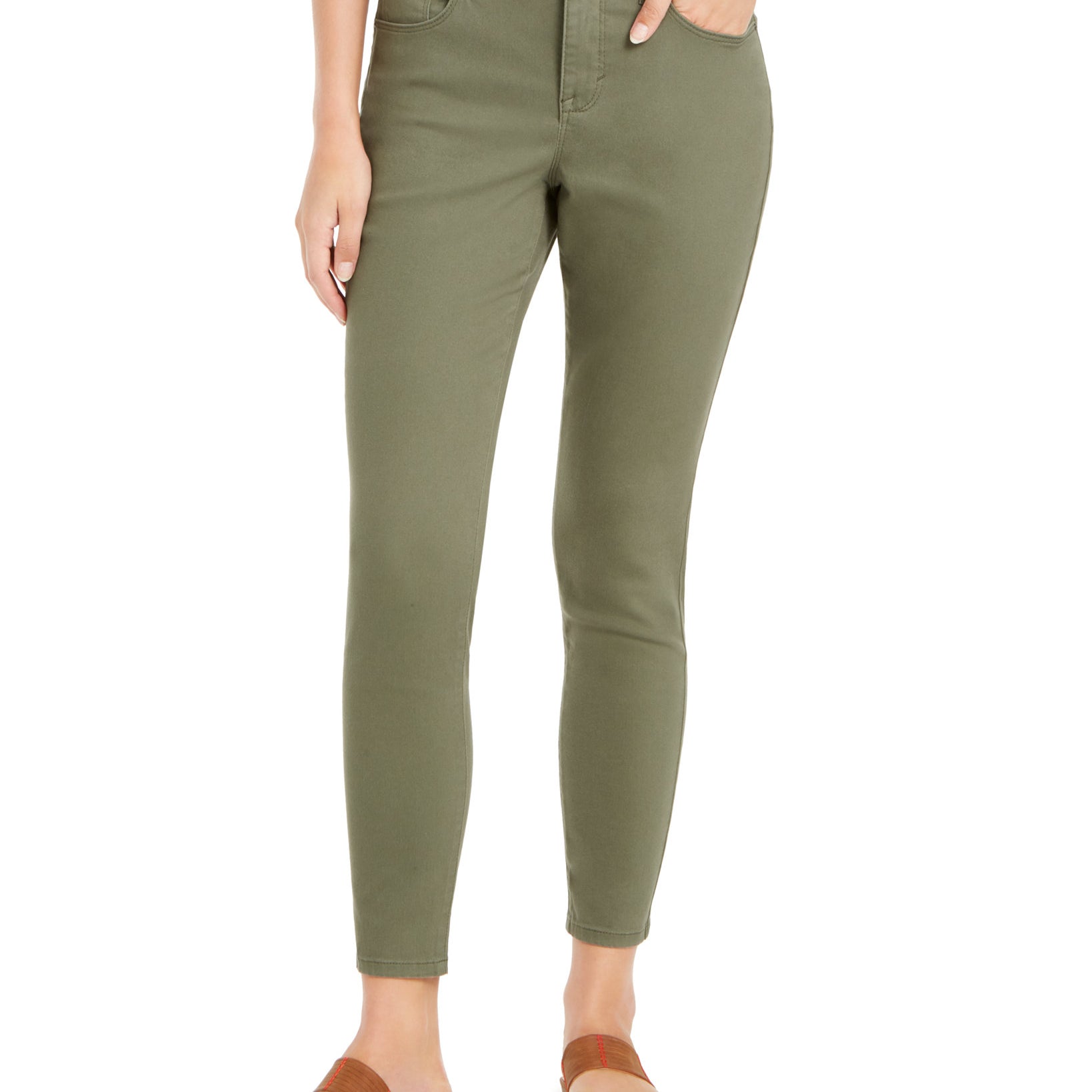 Person wearing olive green pants on a white background