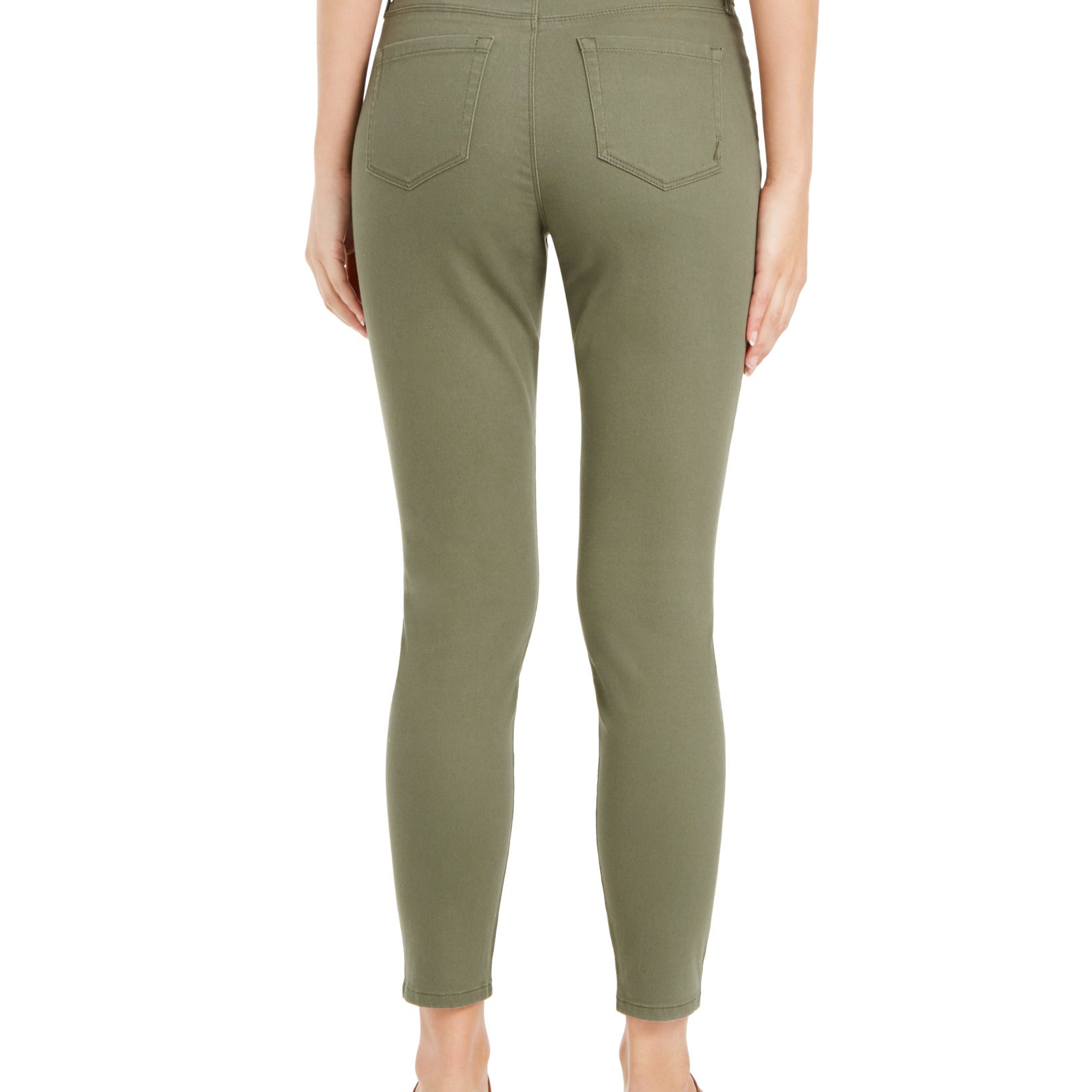 Person wearing olive green pants on a white background