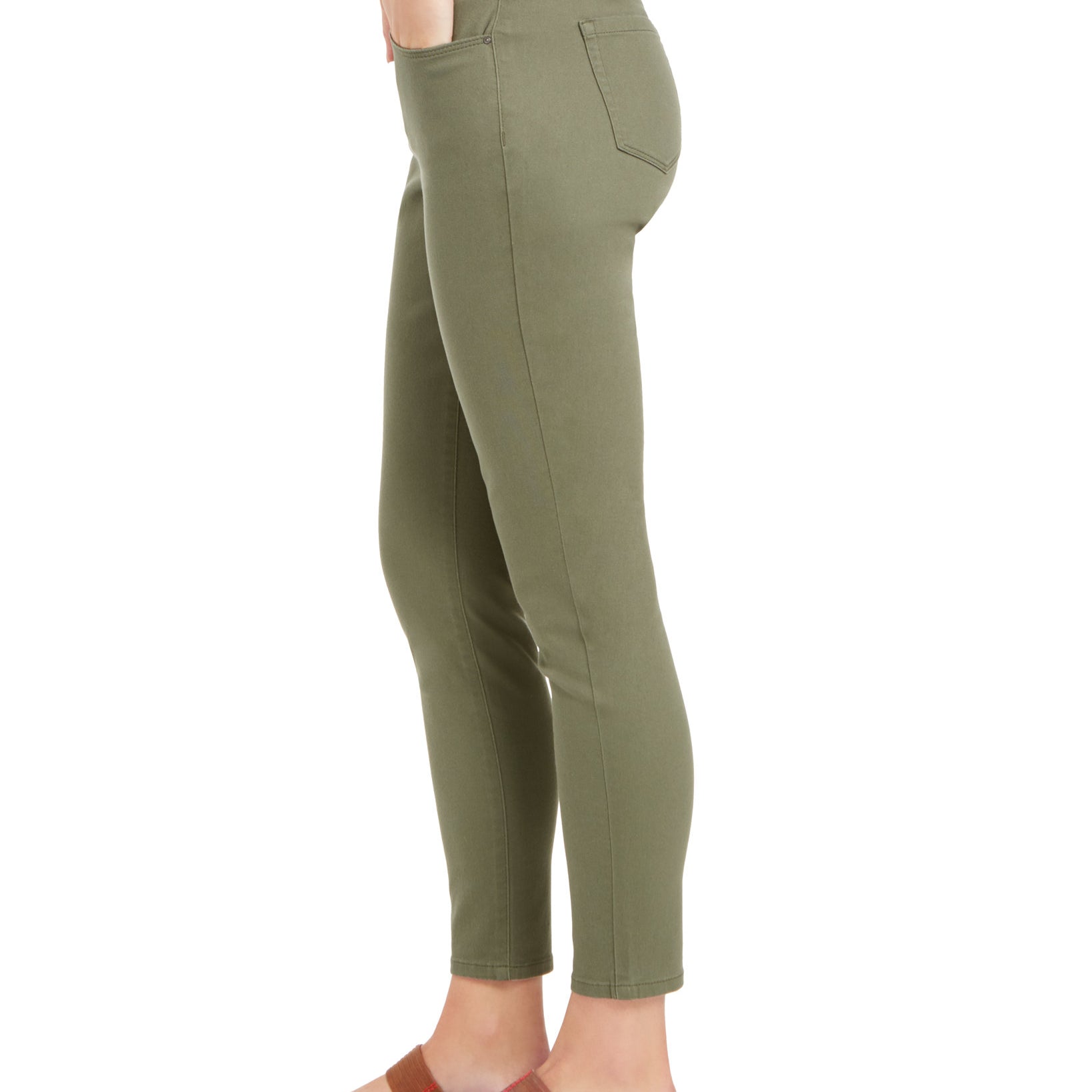 Green pants worn by a person on a white background