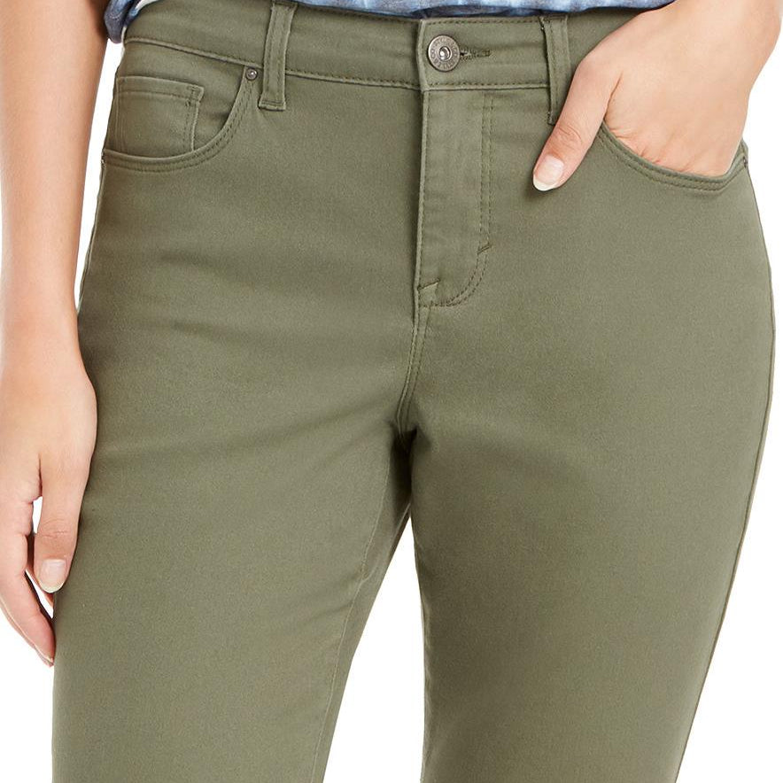Olive green pants worn by a person on a white background