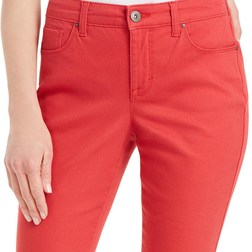 Red pants worn by a person on a white background