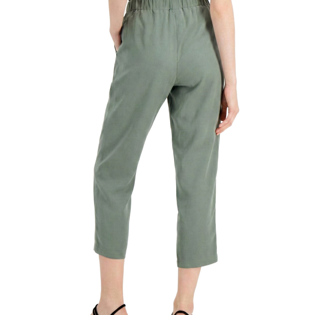 Person wearing green pants on a white background