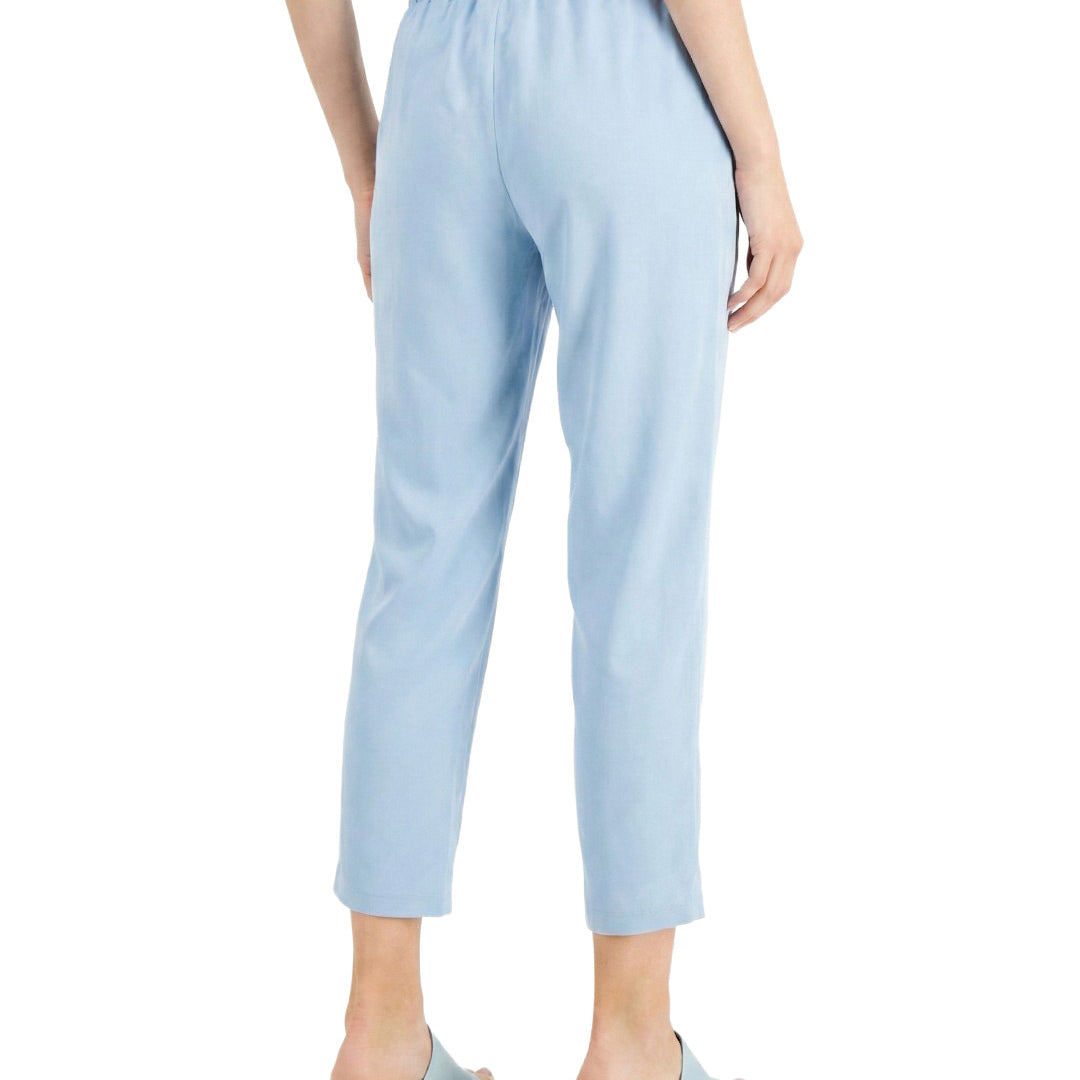 Light blue pants worn by a person on a white background