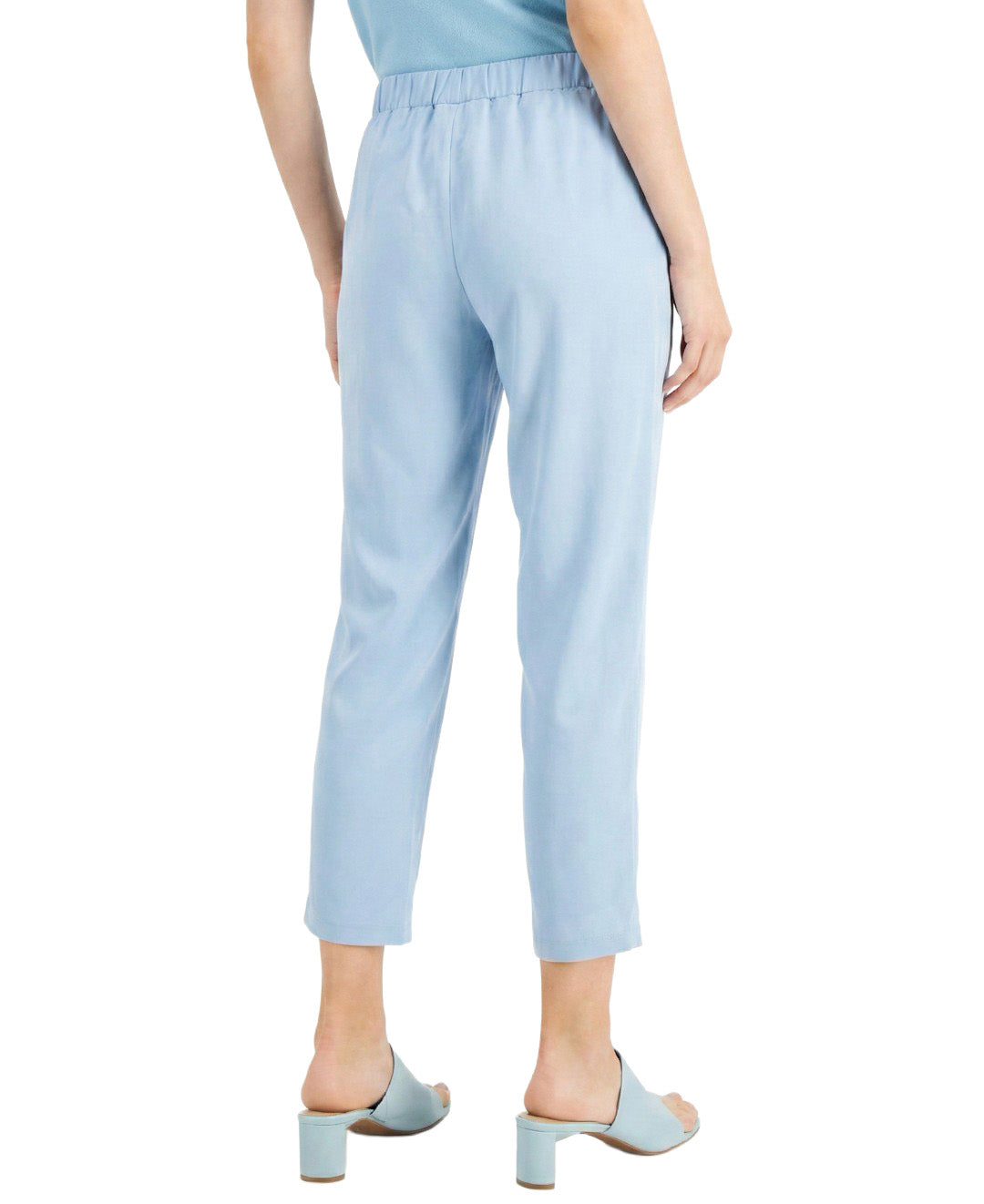 Light blue pants worn by a person on a white background