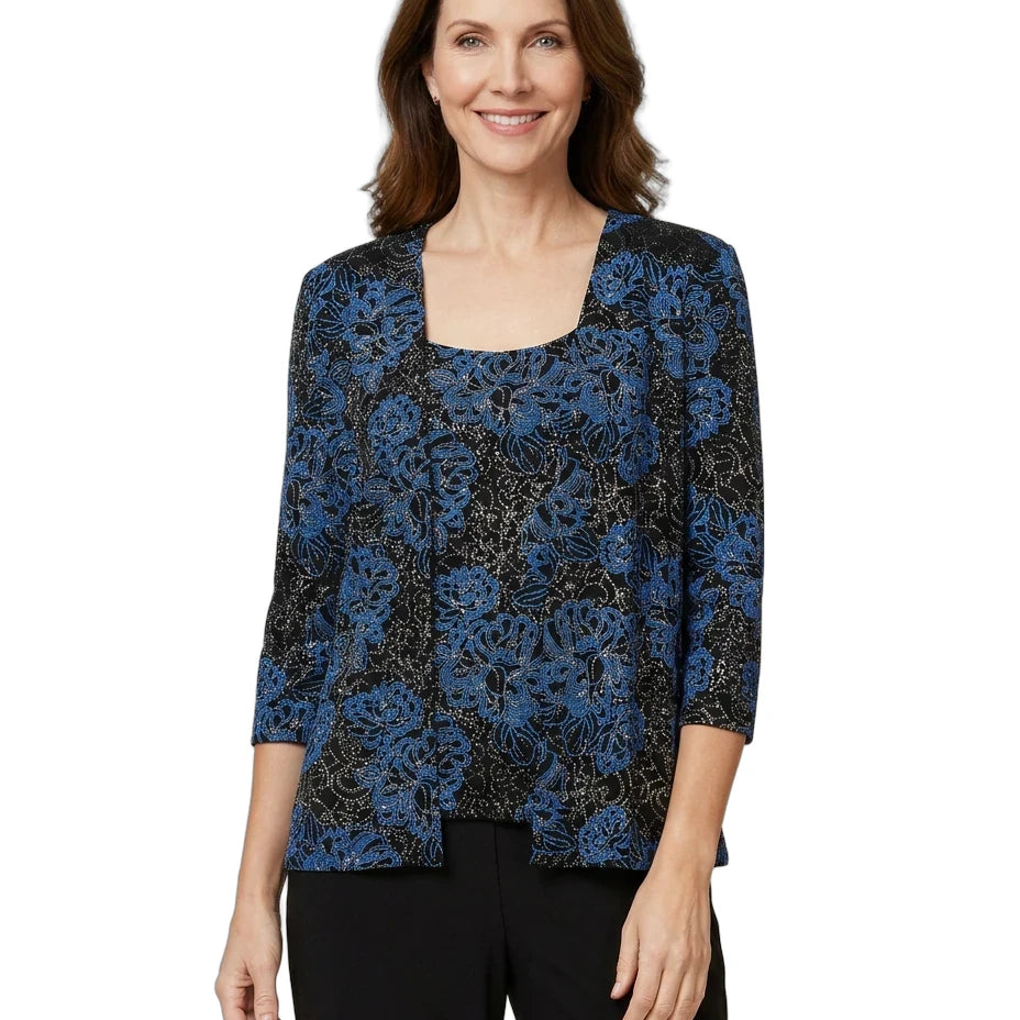 Woman wearing a blue floral patterned top on a white background