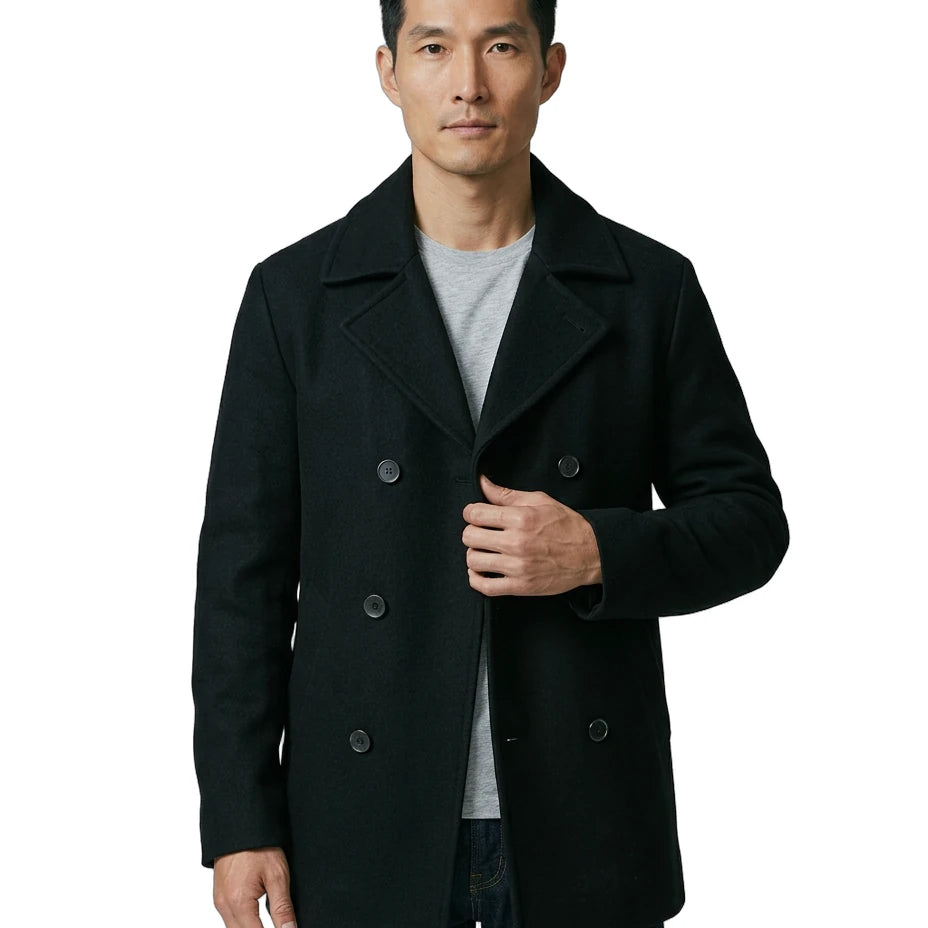 Man wearing a black coat on a white background