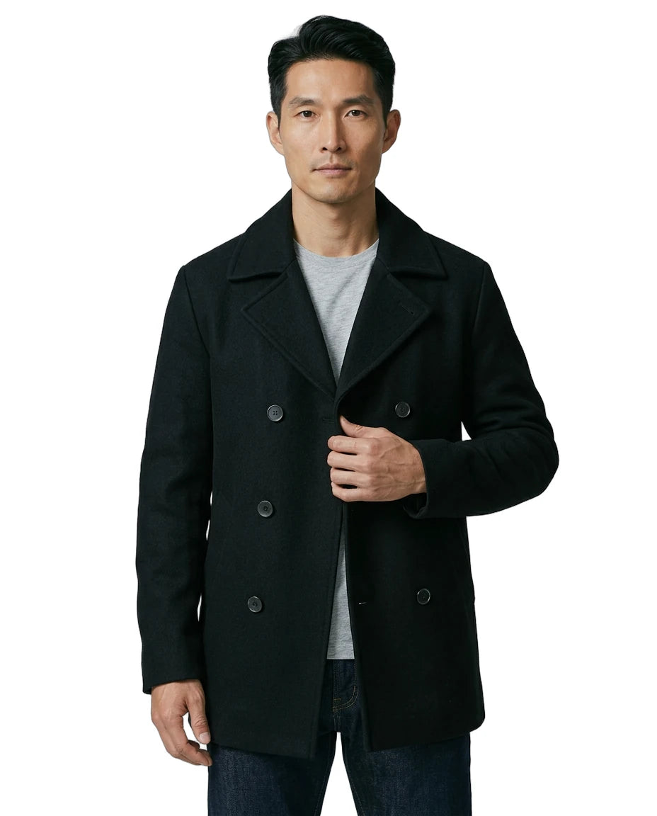 Man wearing a black coat on a white background