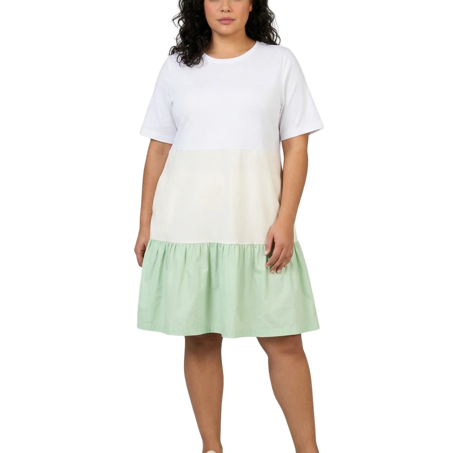 Woman wearing a white and green dress on a white background