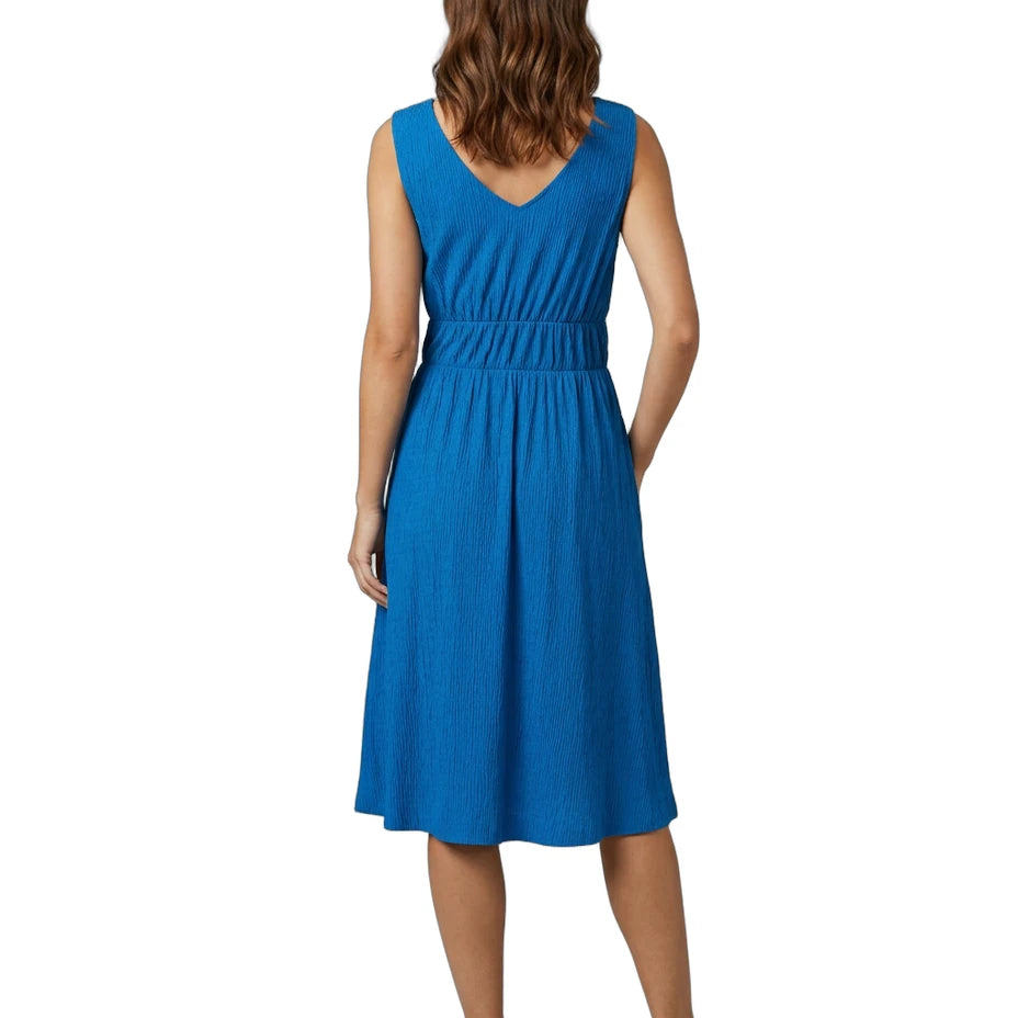 Woman wearing a blue dress on a white background