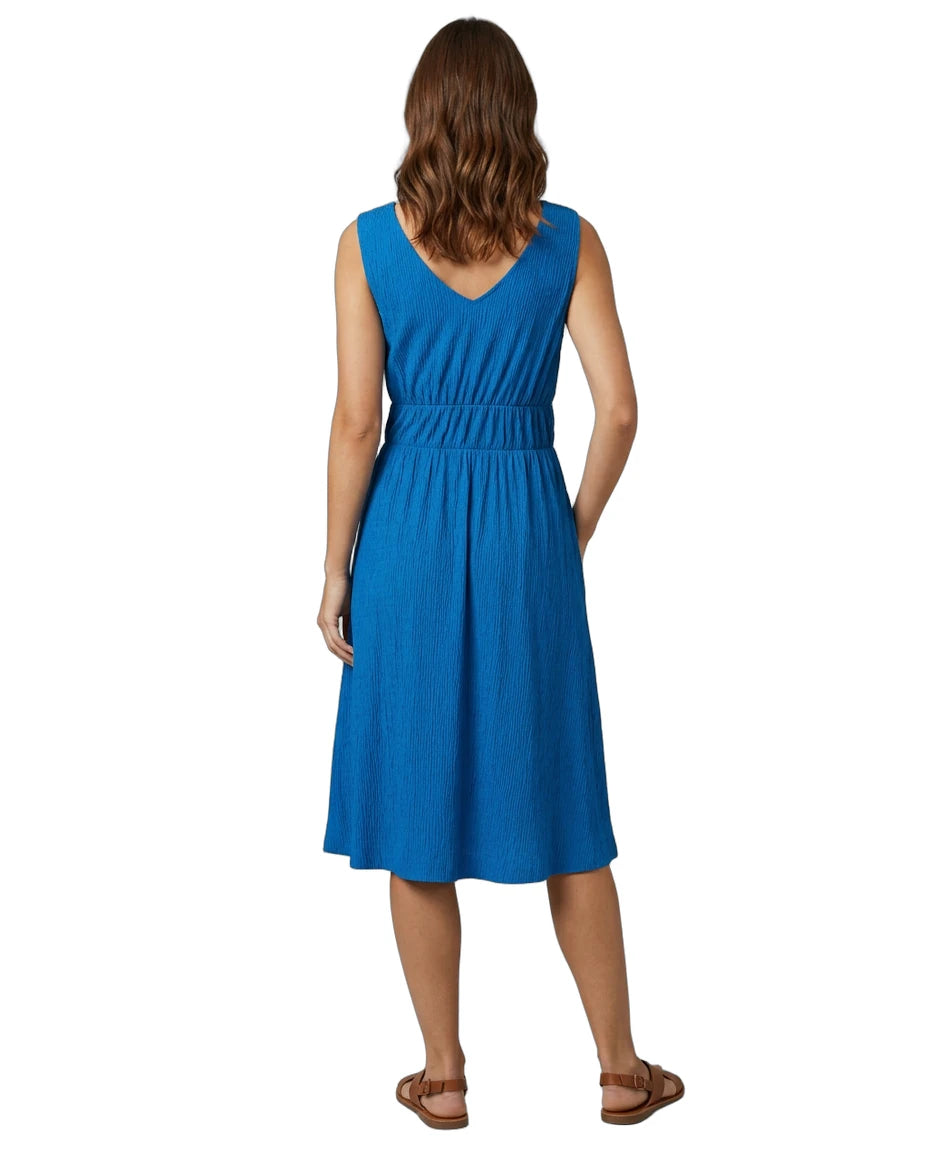 Woman wearing a blue dress on a white background