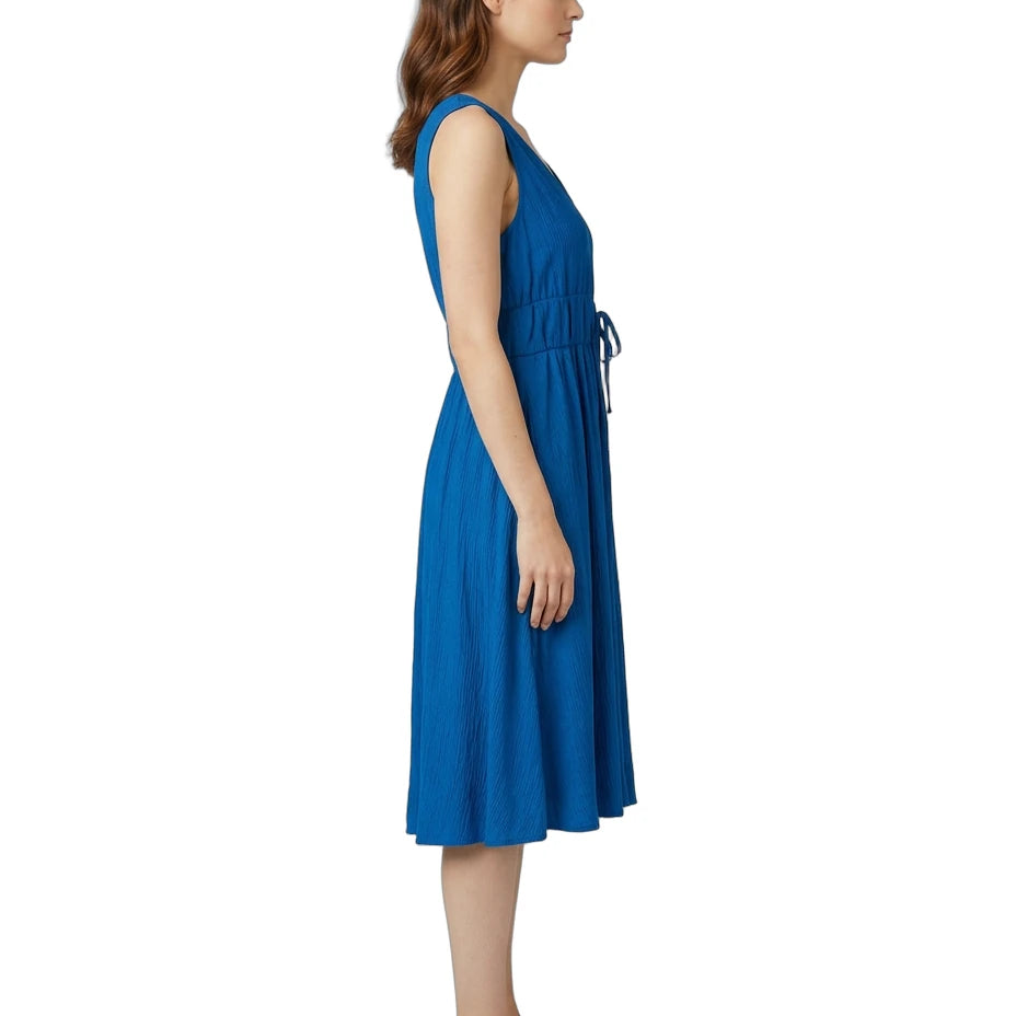 Woman wearing a blue dress on a white background