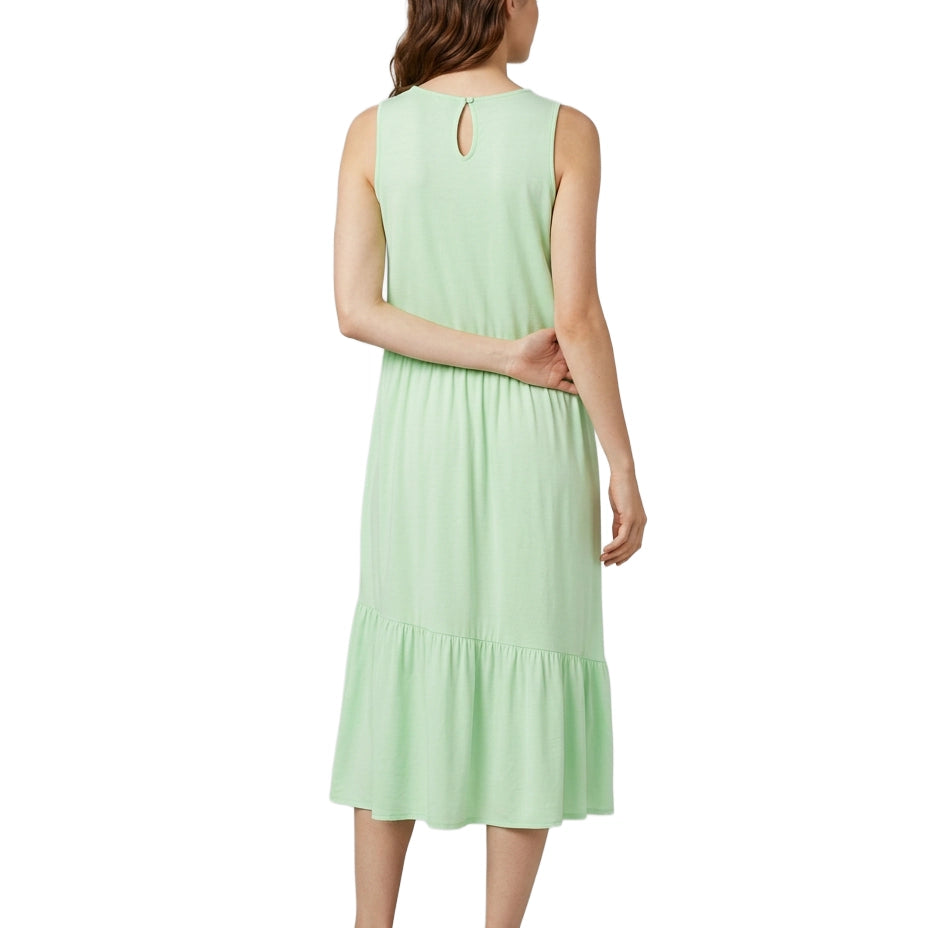 Woman wearing a light green dress on a white background