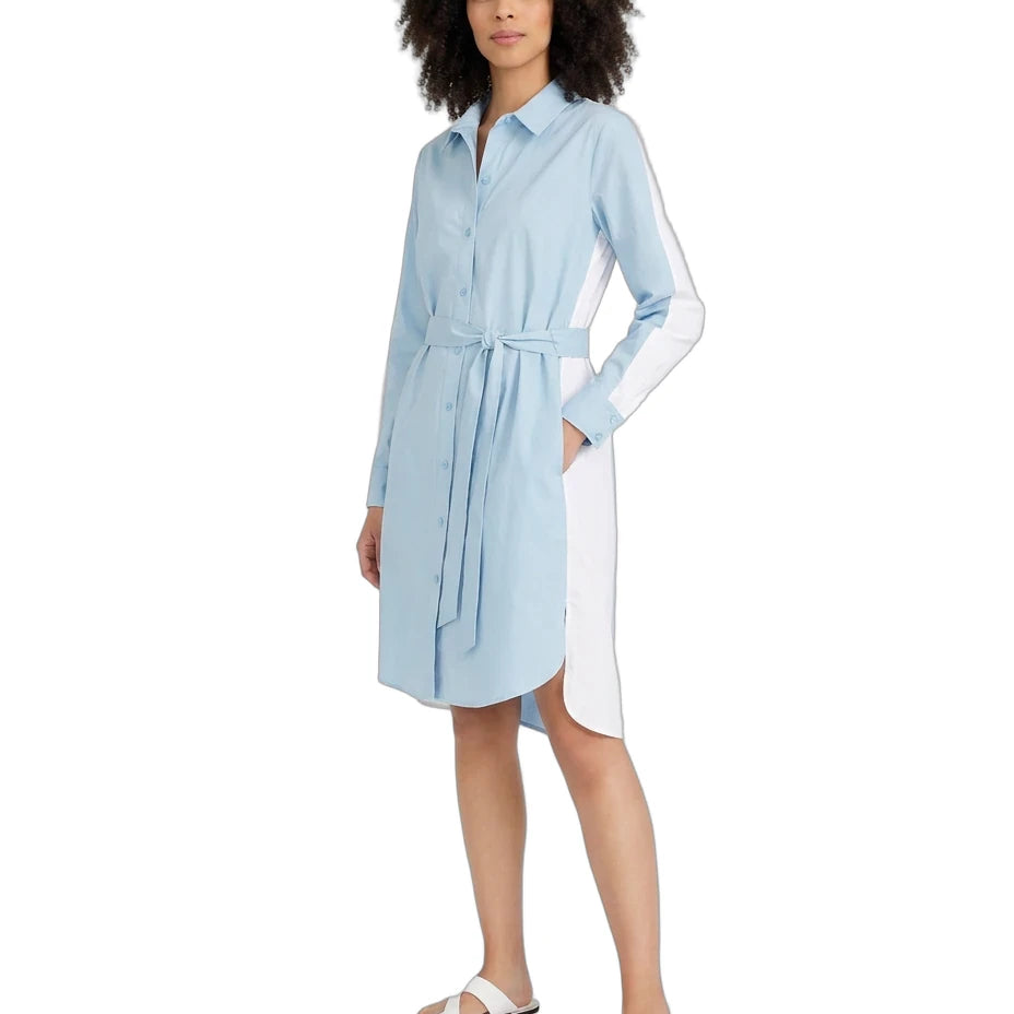 A woman modeling a light blue and white color-block shirt dress with a tie waist belt, shown against a plain white background.
