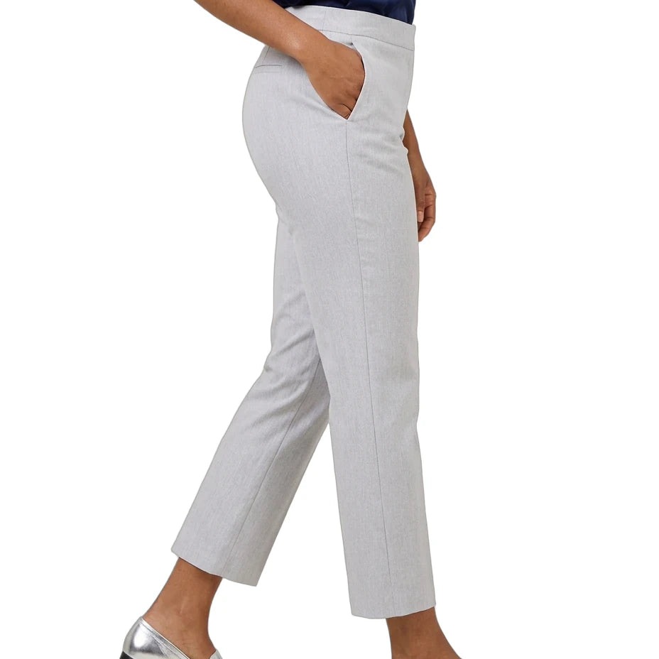 A person wearing light gray cropped trousers with side pockets, paired with a navy top and metallic silver loafers, shown against a plain white background.