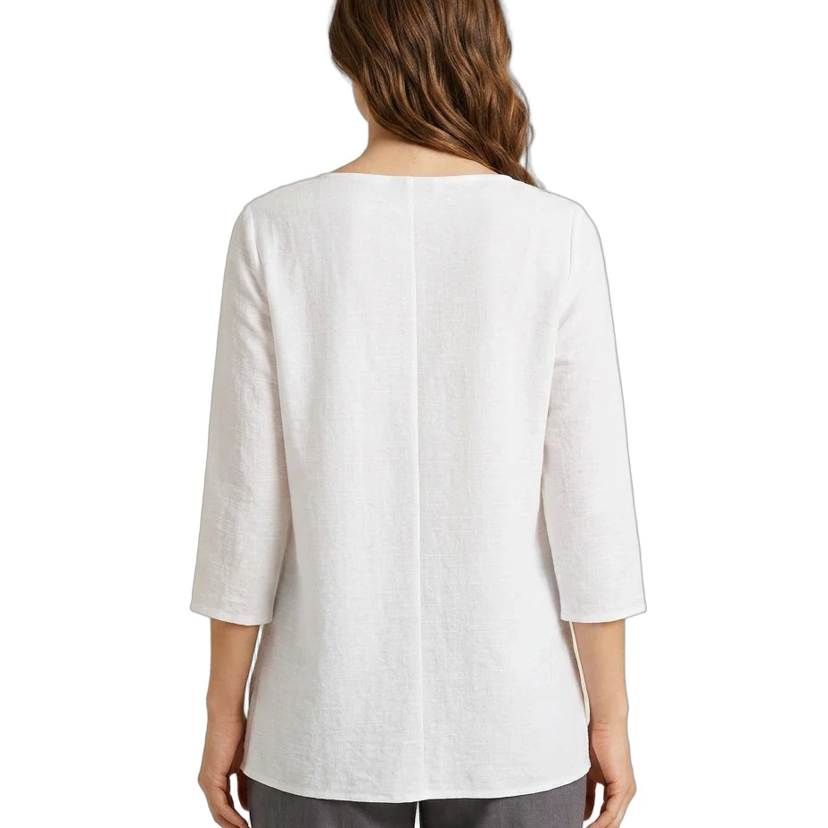 Woman wearing a white blouse with a three-quarter sleeve on a white background