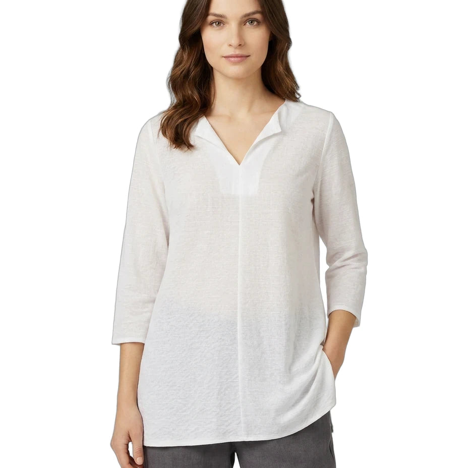 Woman wearing a white blouse with a V-neck and 3/4 sleeves on a white background