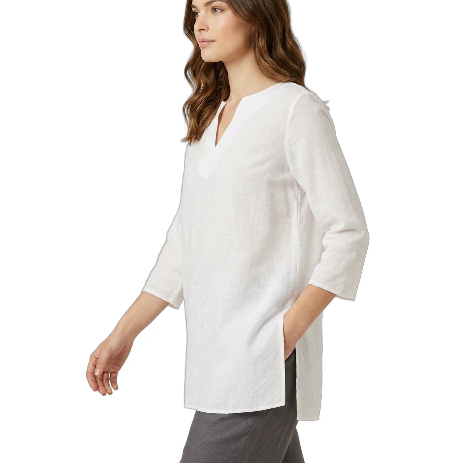 Woman wearing a white blouse with a V-neck and three-quarter sleeves on a white background