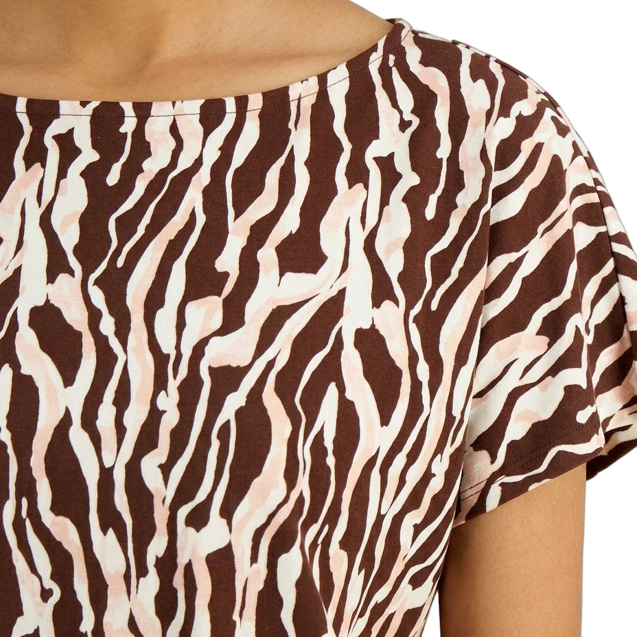 Close-up of a brown and beige zebra print top on a person.