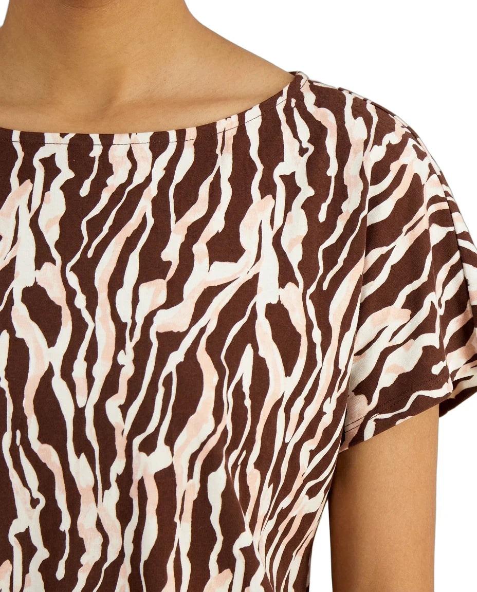 Close-up of a brown and beige zebra print top on a person.