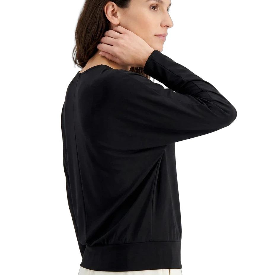 Woman wearing a black sweater on a white background