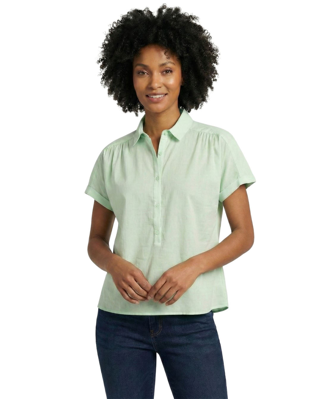 Woman wearing a light green short-sleeve blouse on a white background