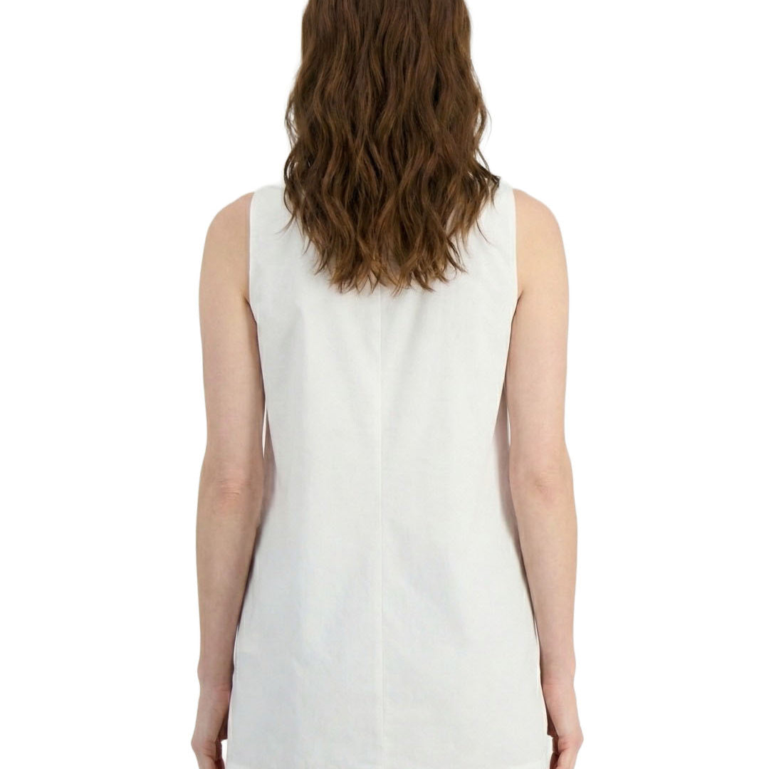 Woman wearing a white sleeveless top on a white background