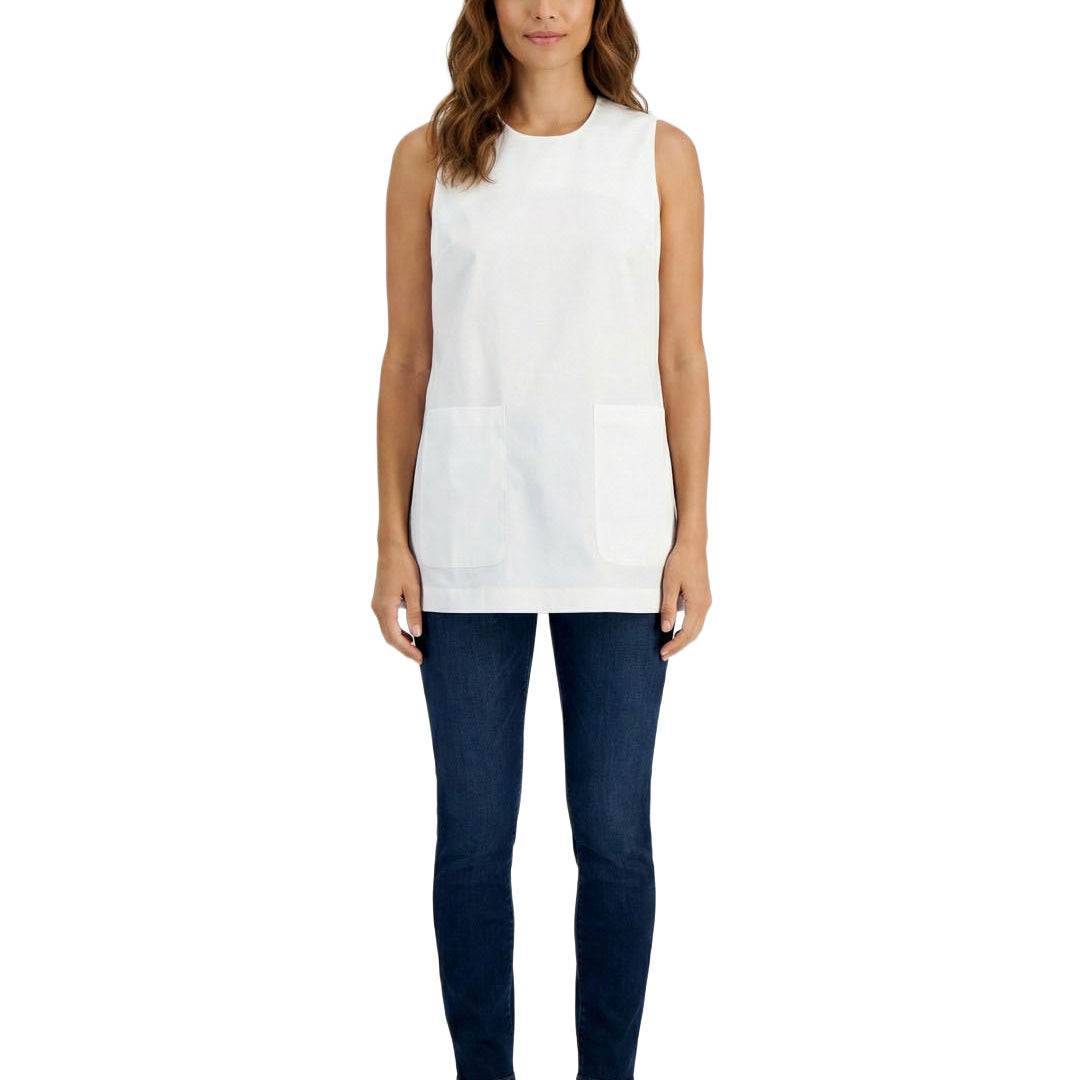 Woman wearing a white sleeveless top and dark blue pants on a white background