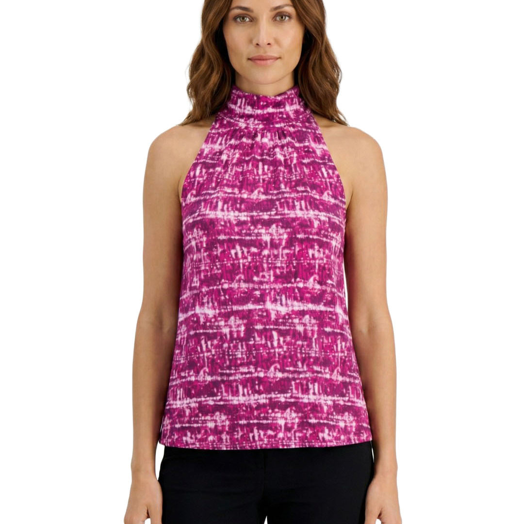 Woman wearing a pink and purple patterned sleeveless top on a white background