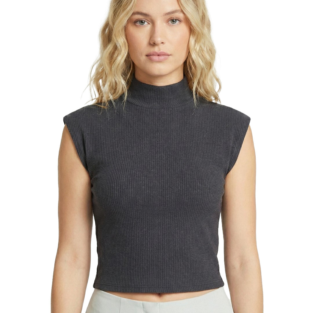 Woman wearing a dark gray sleeveless ribbed top on a white background
