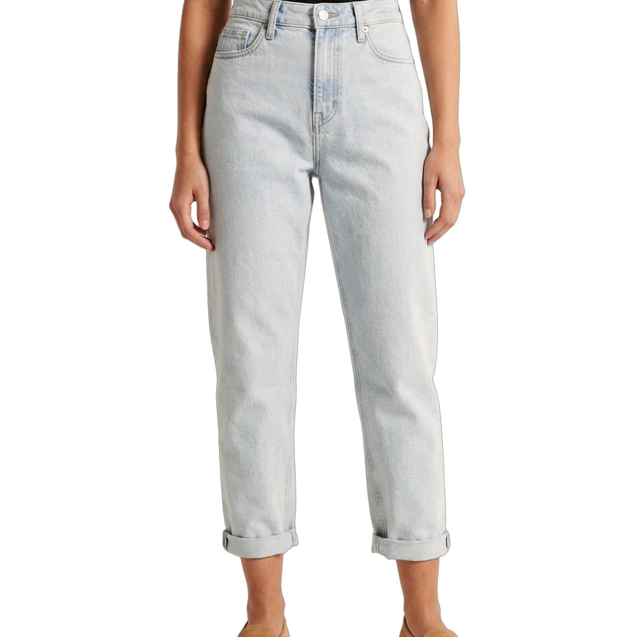 Light blue Calvin Klein jeans worn by a person on a white background