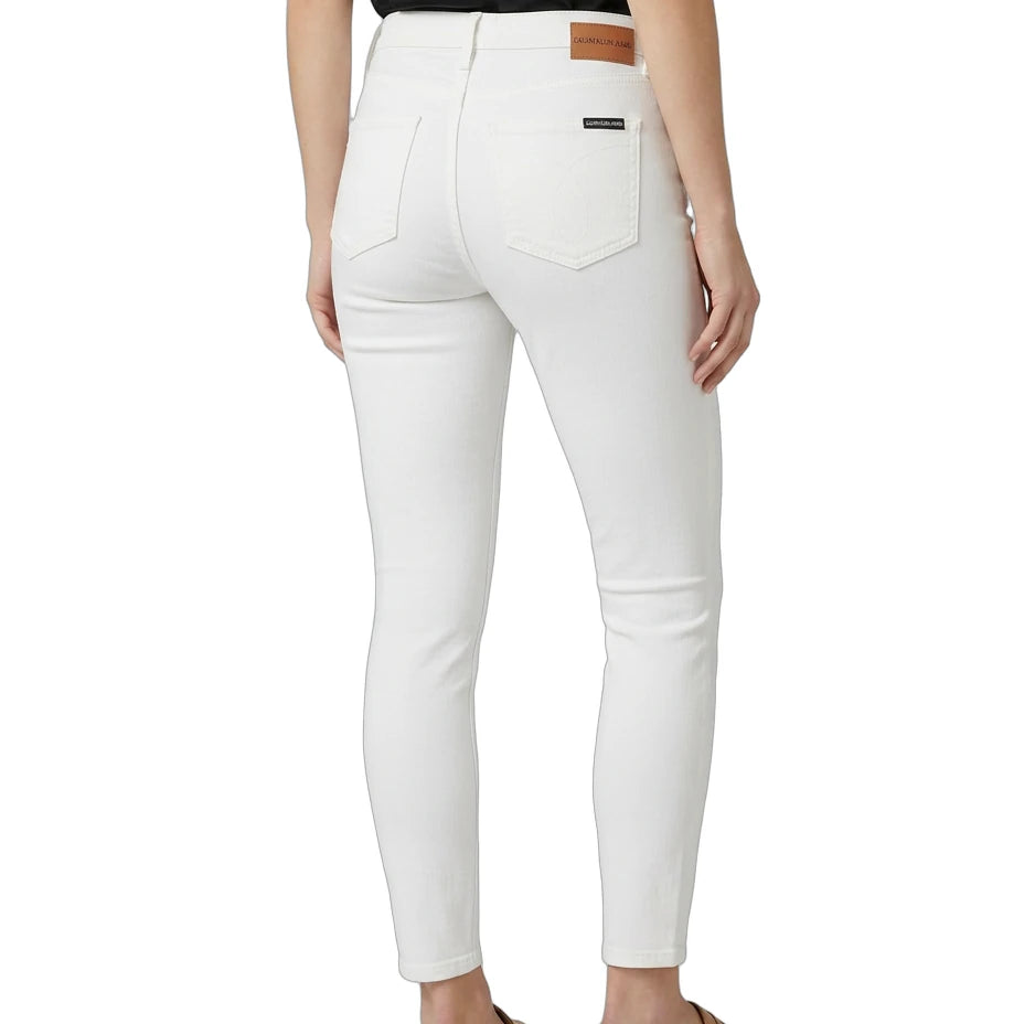 White jeans worn by a person on a white background