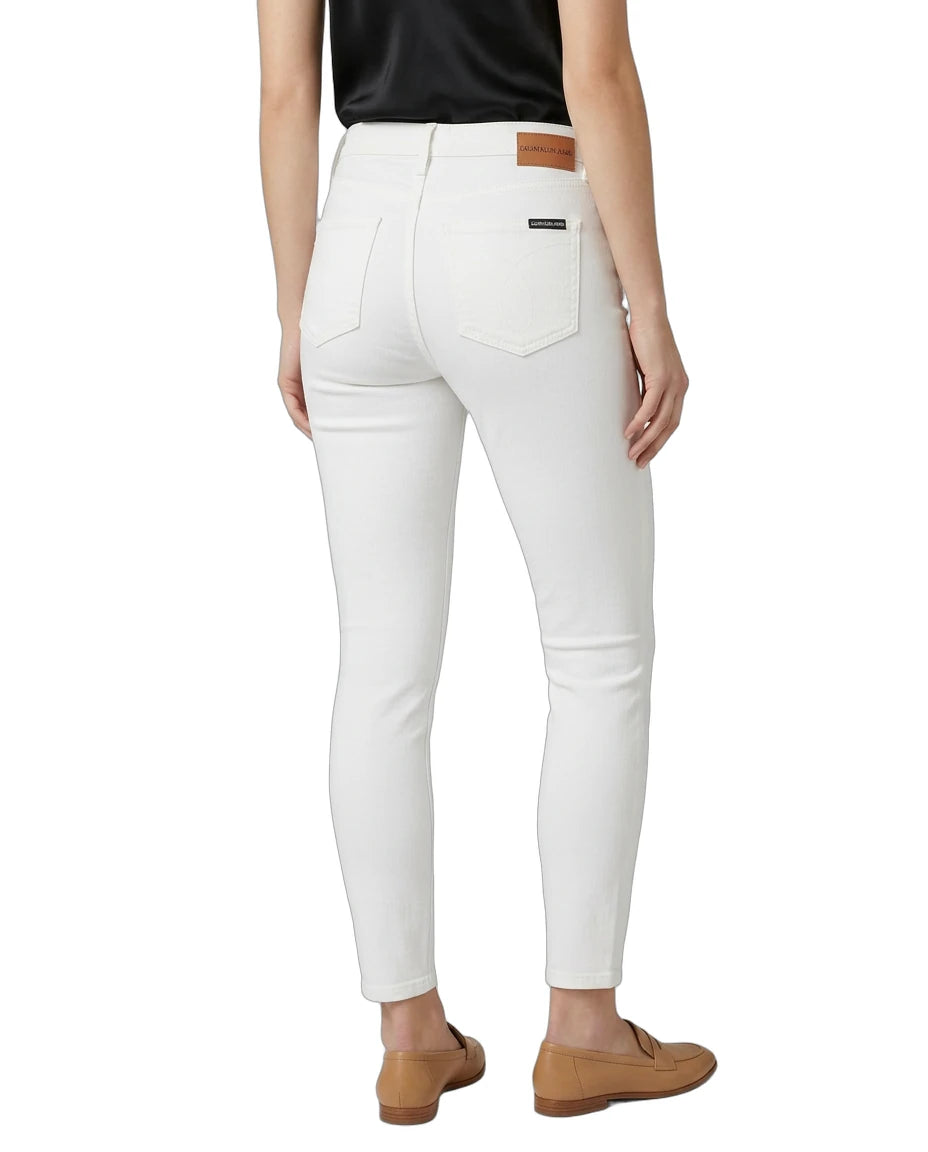 White jeans worn by a person on a white background