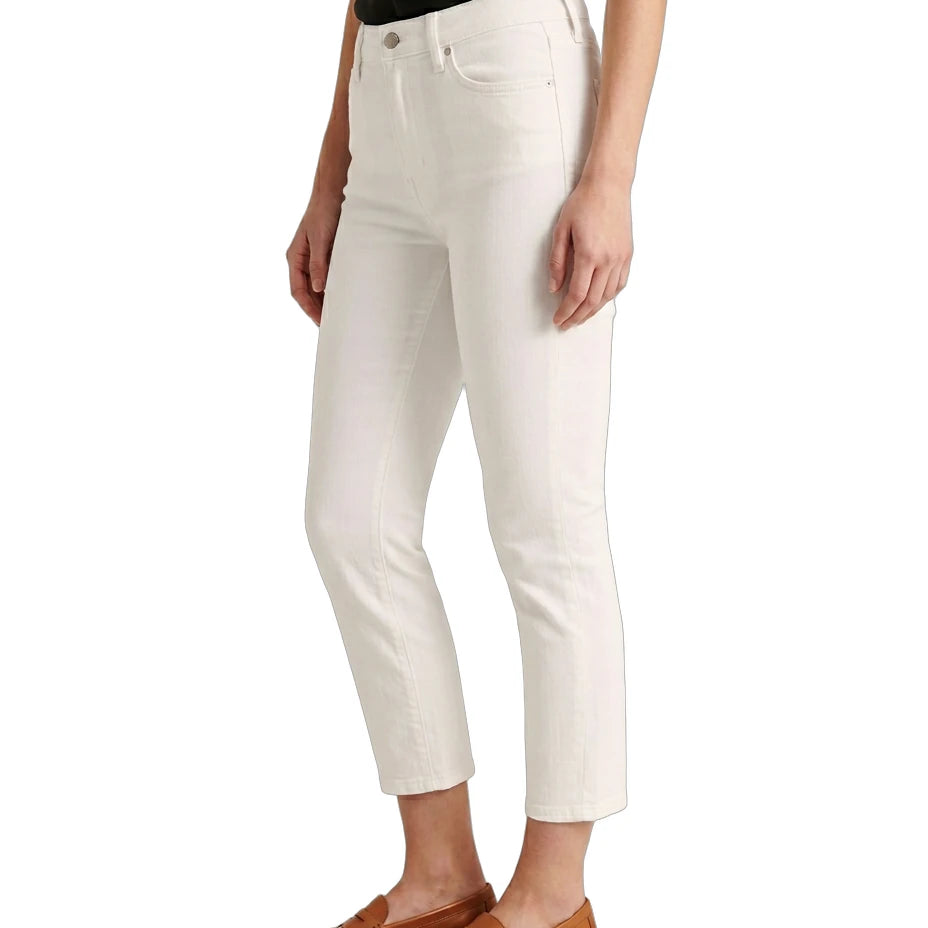Person wearing white pants and brown shoes on a white background