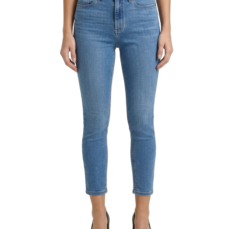 Blue jeans worn by a person on a white background