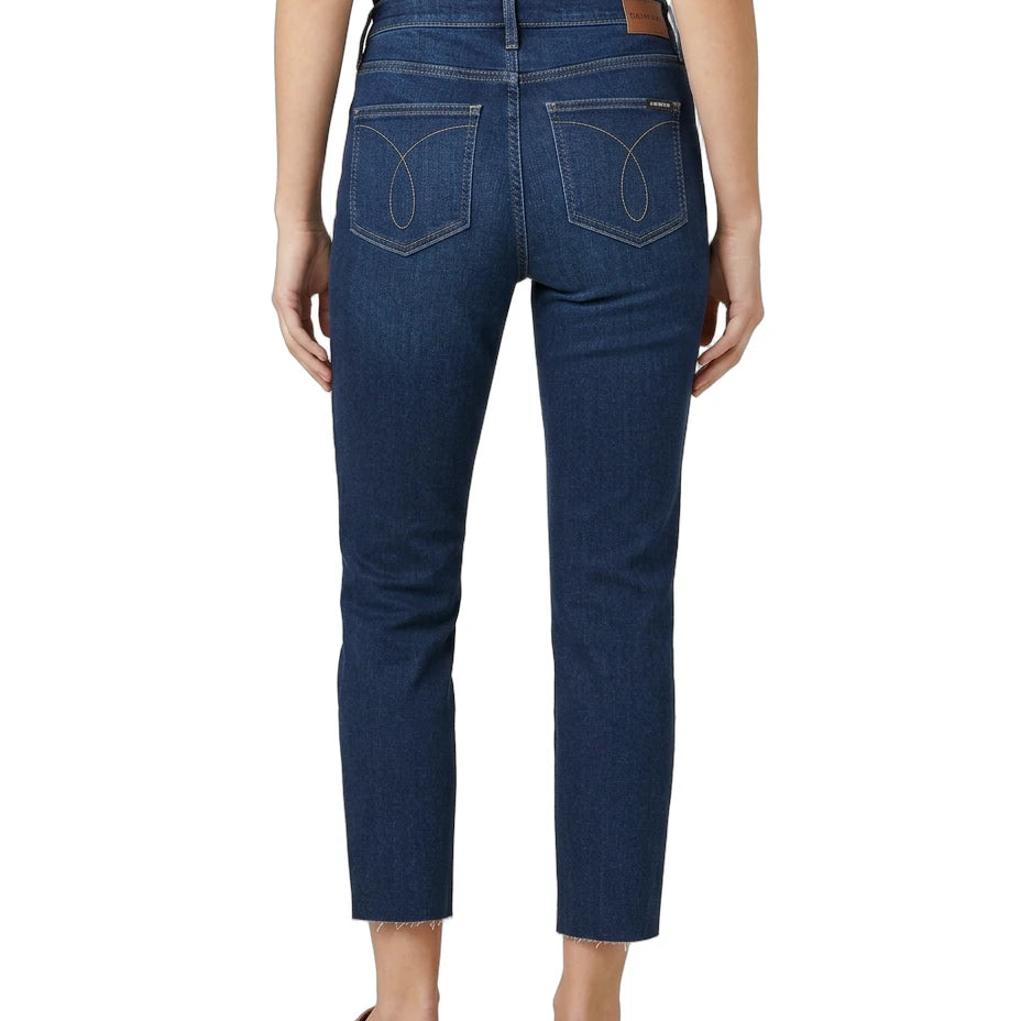Person wearing blue jeans on a white background