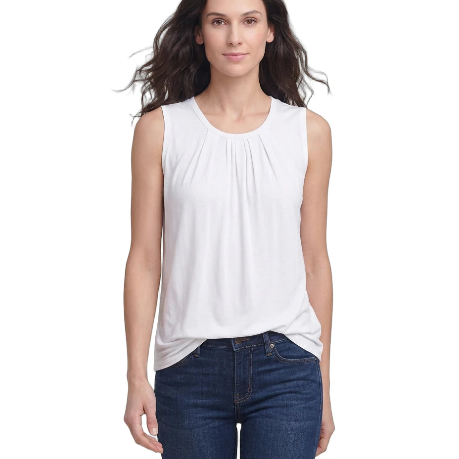 Woman wearing a white sleeveless top and blue jeans on a white background