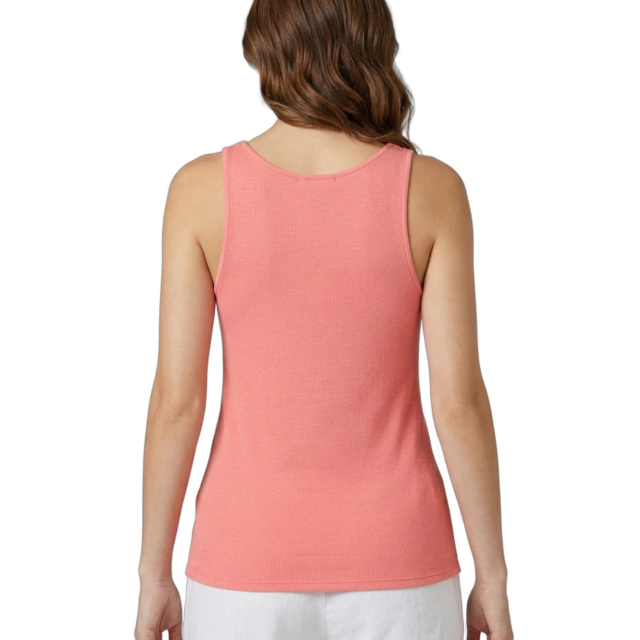 Woman wearing a coral Calvin Klein tank top on a white background