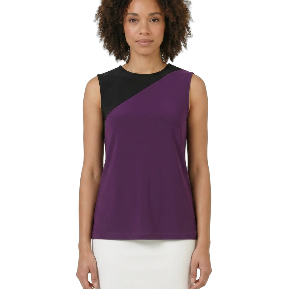 Woman wearing a sleeveless purple and black top on a white background
