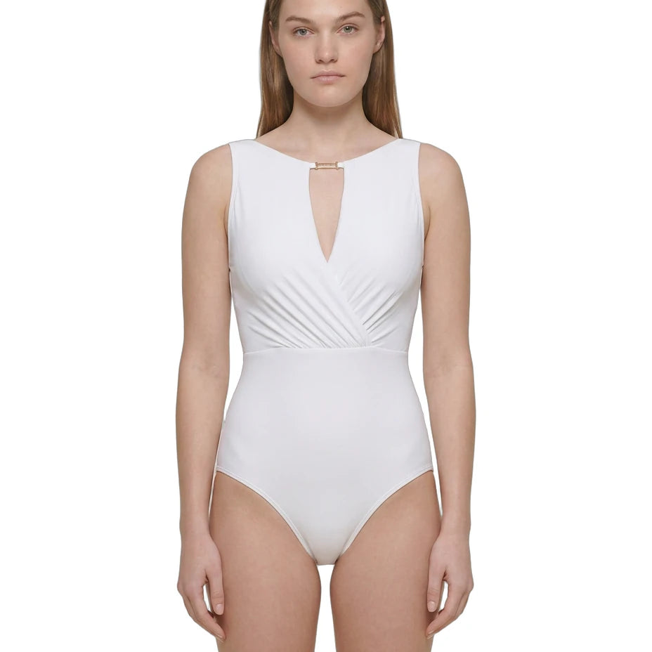 Woman wearing a white swimsuit on a white background