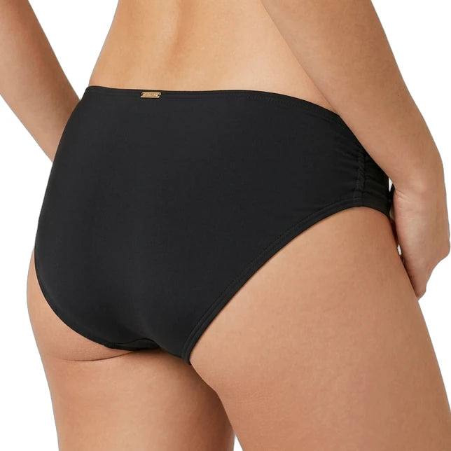 black calvin klein bikini bottom worn by a person on a white background