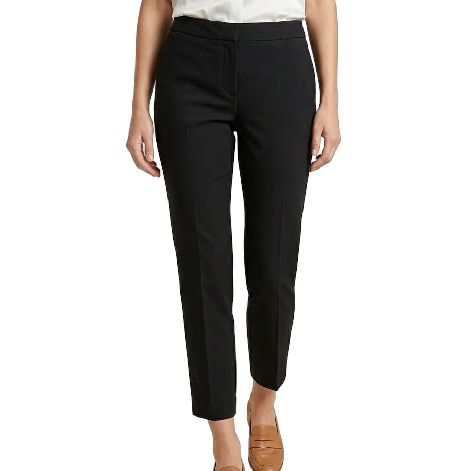 Person wearing black Calvin Klein pants and a white shirt on a white background