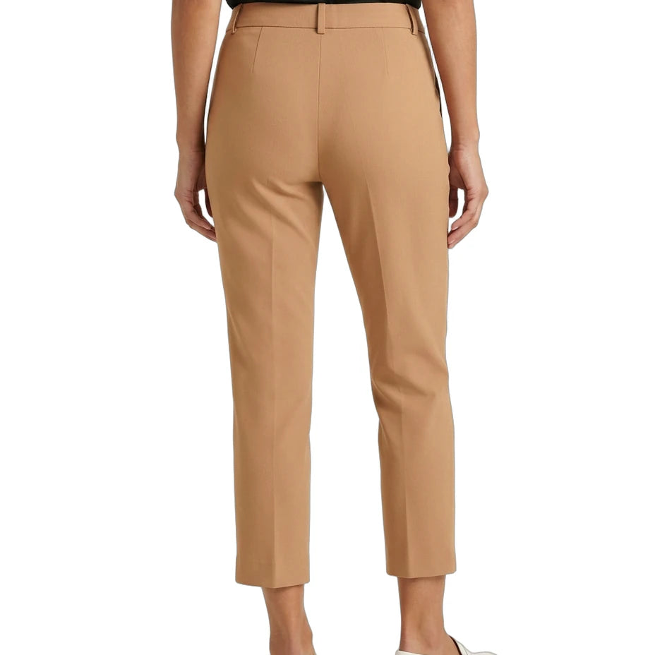 Tan Calvin Klein pants worn by a person on a white background