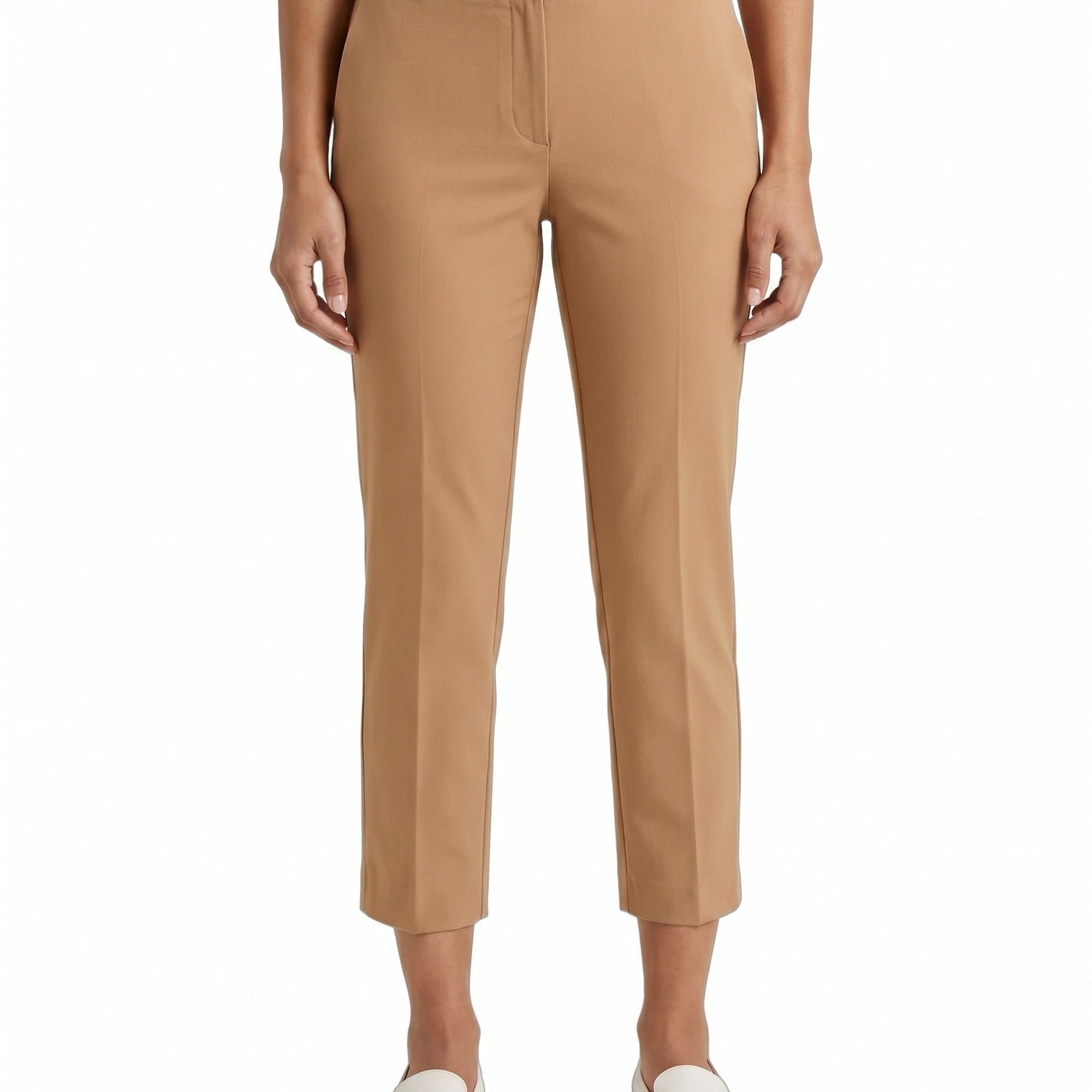 Tan Calvin Klein pants worn by a person on a white background
