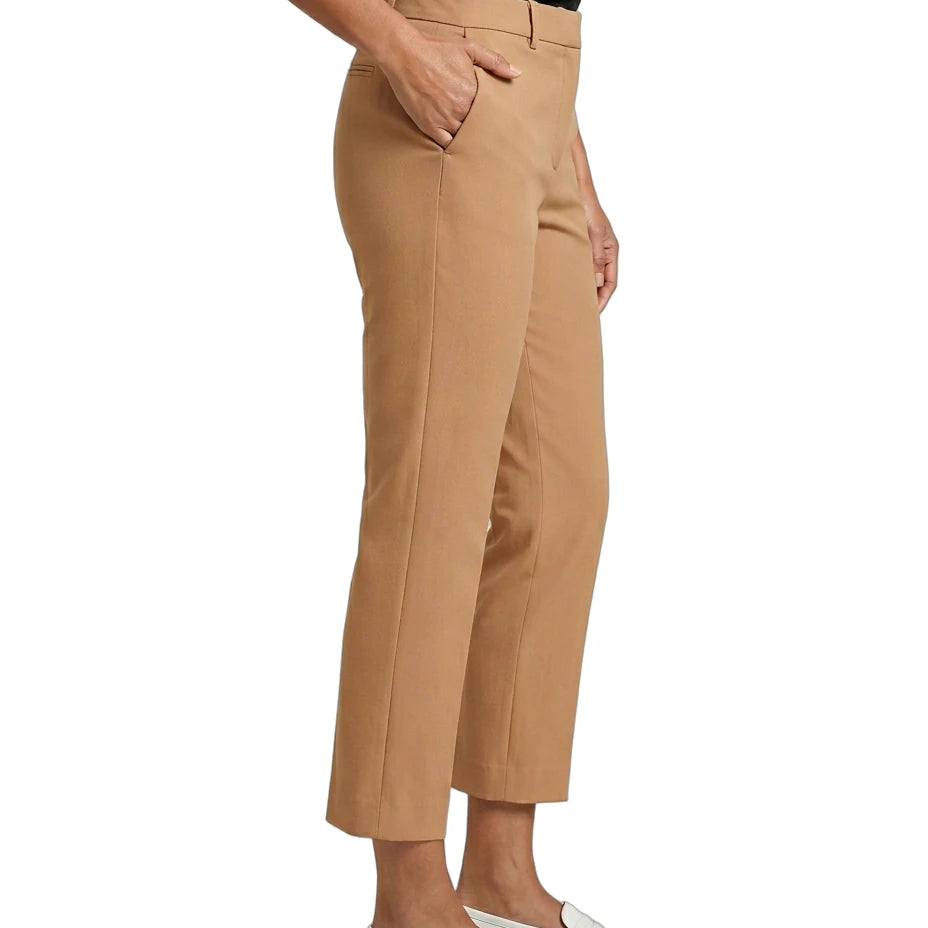 Tan Calvin Klein pants worn by a person on a white background