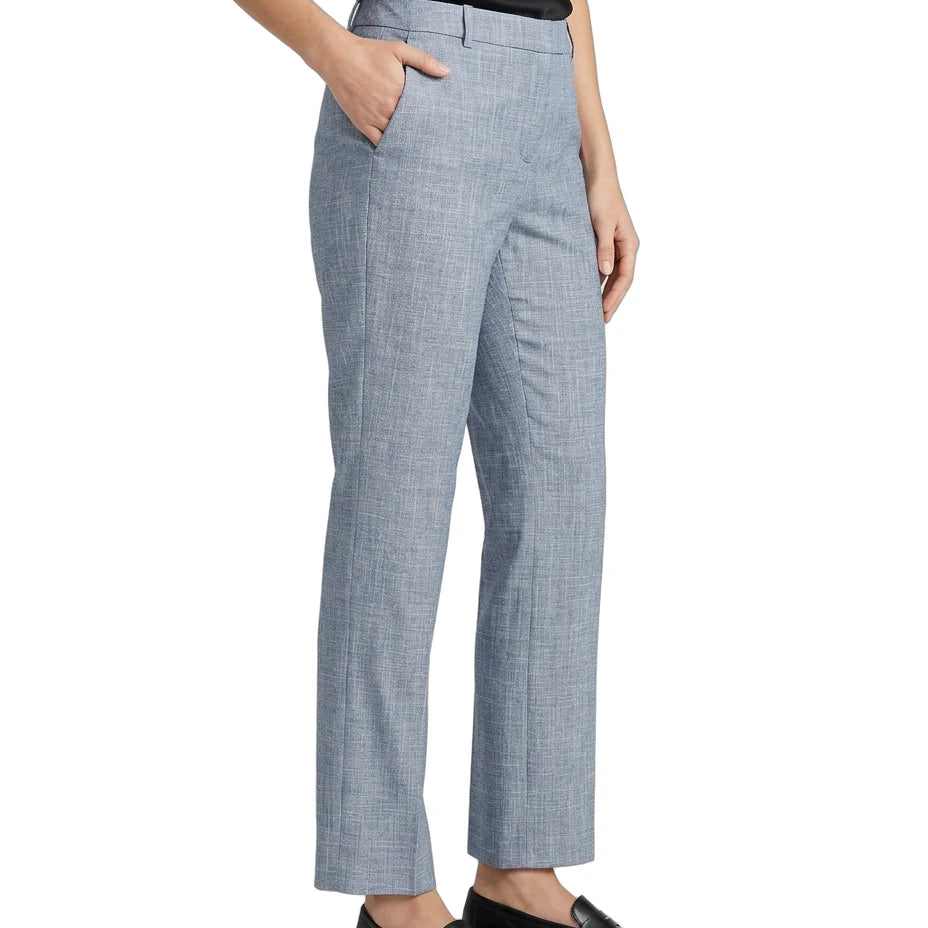 Person wearing Calvin Klein blue checkered pants on a white background