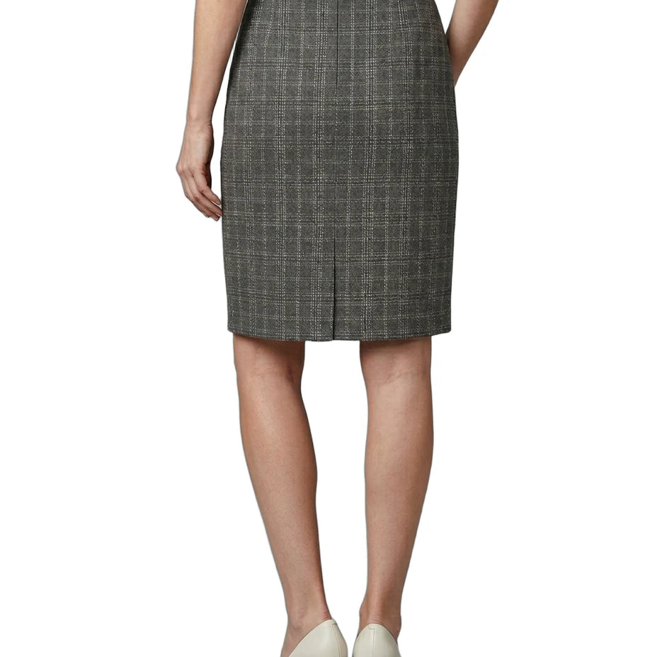Person wearing a gray checkered skirt on a white background
